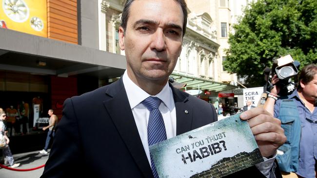 SA Opposition Leader Steven Marshall pictured in 2014 holding the Labor flyer that attacked Liberal candidate Carolyn Habib. Picture: File