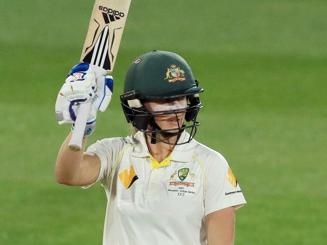 Australia’s Ellyse Perry celebrates bringing up her half century against England on Friday night.