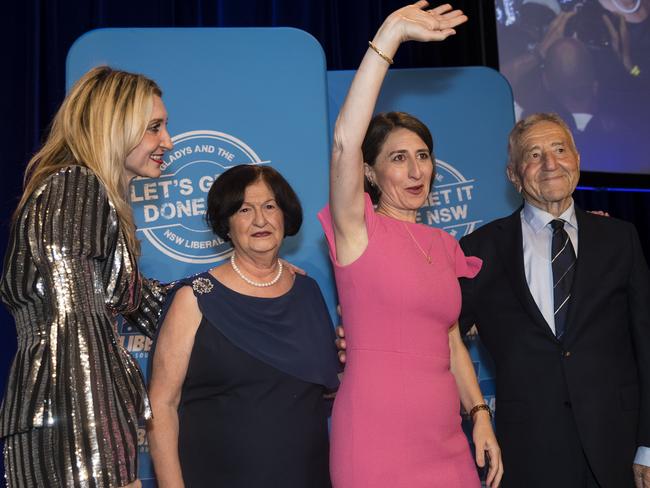 A triumphant Gladys Berejiklian with her sister Mary, mum Arsha and dad Krikorat. Picture: Brook Mitchell/Getty