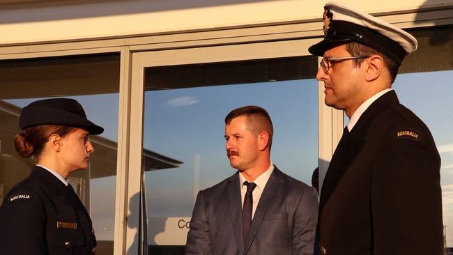 Luke MacMaster, centre, speaks to his lawyers outside the Defence Force Magistrates Court in Canberra. Picture: Blake Foden