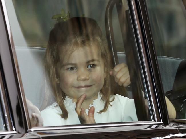 Princess Charlotte waves as she arrives by car for the wedding. Picture: Getty