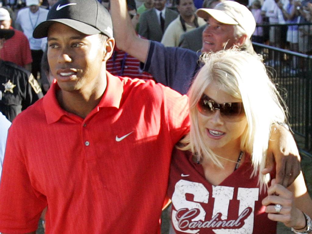 Tiger Woods celebrates with wife Elin Nordegren.