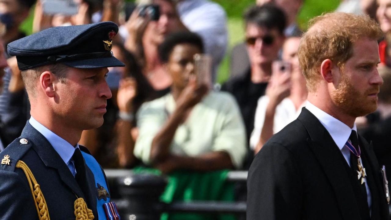 Britain's Prince William, Prince of Wales and Britain's Prince Harry, Duke of Sussex walk behind the coffin of Queen Elizabeth II (Photo by SEBASTIEN BOZON / AFP)