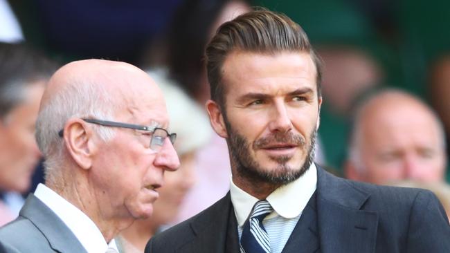 LONDON, ENGLAND - JULY 02:  David Beckham and Sir Bobby Charlton are in discussion in the Royal Box on day six of the Wimbledon Lawn Tennis Championships at the All England Lawn Tennis and Croquet Club on July 2, 2016 in London, England.  (Photo by Julian Finney/Getty Images)