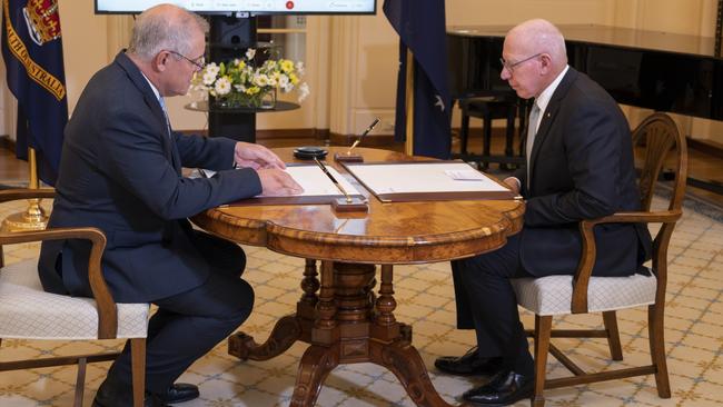 Then-PM Scott Morrison (left) and Governor-General David Hurley conduct a swearing-in ceremony at Government House, Canberra in March last year. Picture: NCA NewsWire / Martin Ollman