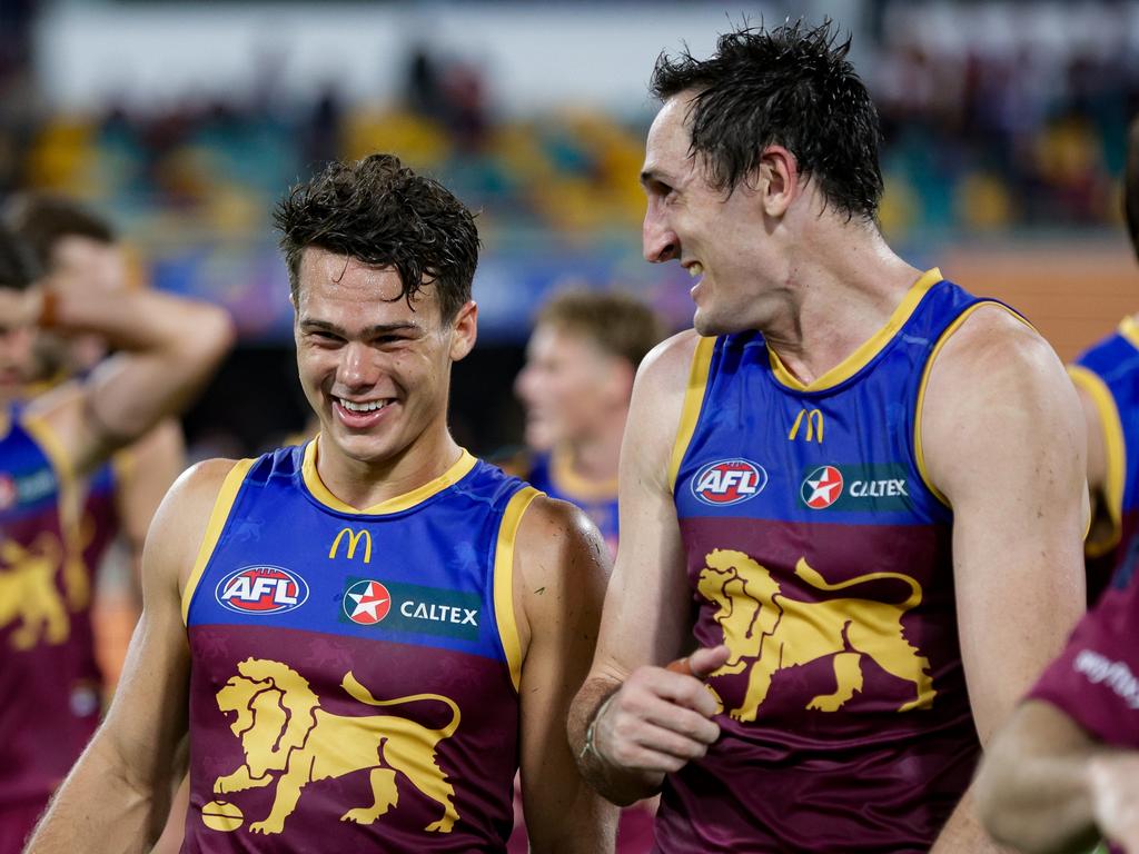 Lions pair Cam Rayner (left) and Oscar McInerney reflect on Brisbane’s QClash win. Picture: Russell Freeman/AFL Photos via Getty Images