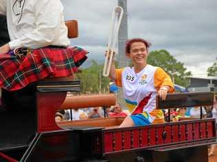 ARRIVING IN STYLE: Batonbearer Claire Keefer rides into the Gatton Showgrounds on a carriage. Picture: Dominic Elsome