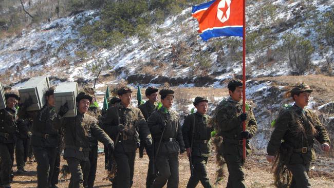 epa03635452 A picture released by the North Korean Central News Agency on 22 March 2013, alleged to show the North Korean army conducting a drill in an undisclosed location on 21 March 2013. North Korea recently stepped up its military threats toward the South as South Korean and US soldiers are conducting their annual joint military drill, Foal Eagle. The communist country berates the exercise as war maneuvers against it. EPA/KCNA HANDOUT SOUTH KOREA OUT