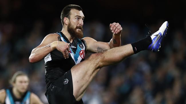 Charlie Dixon kicks a goal in the qualifying final against Geelong.