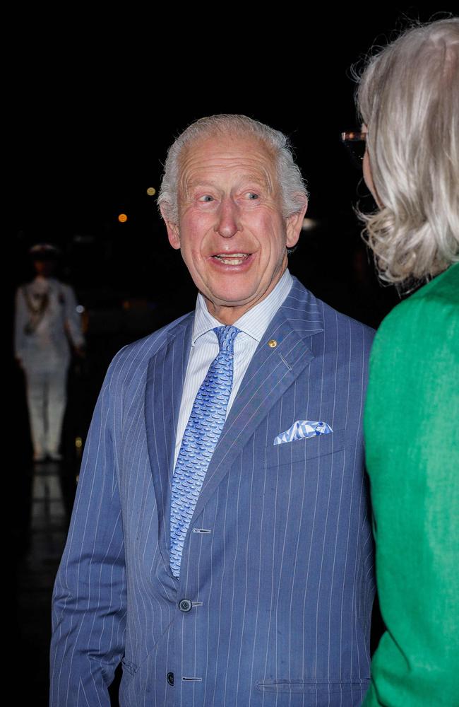 Britain's King Charles III speaks to Australia's Governor-General Sam Mostyn after he and Queen Camilla arrived at Sydney International Airport in Sydney. Picture: AFP