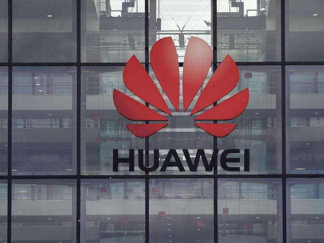 (FILES) In this file photo taken on April 29, 2019 A picture shows the Huawei logo and signage at their main UK offices in Reading, west of London, on April 29, 2019. - Britain is expected to announce next week whether to allow China's Huawei to develop its 5G network, an official said on January 24, 2020, indicating it will agree to limited access despite intense opposition from Washington. (Photo by Adrian DENNIS / AFP)