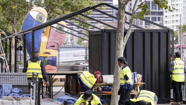 Workers put up outdoor dining areas along Southbank in December Picture : NCA NewsWire / Ian Currie