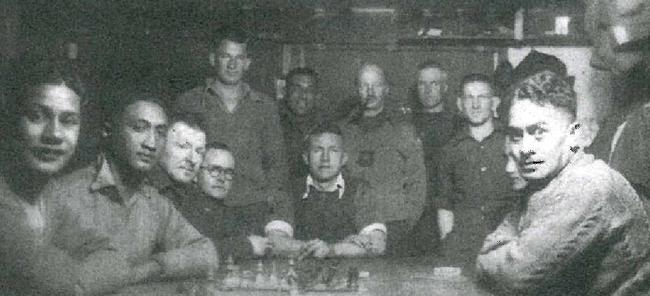 Ted Hamill (back left) with fellow soldiers inside the POW camp Stalag 383 hut in Germany.