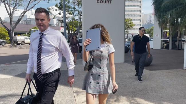 Kayla-Leigh Martin, 22, leaves Darwin Local Court over charges of dealing in identification information and obtaining financial advantage by deception. Her co-accused, employer and boyfriend multi-millionaire Andrew Spira remains in prison on remand.