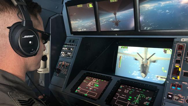 Sergeant Daniel Jorgensen refuels a US Air Force B-1 Lancer aircraft from a Royal Australian Air Force aircraft above Guam