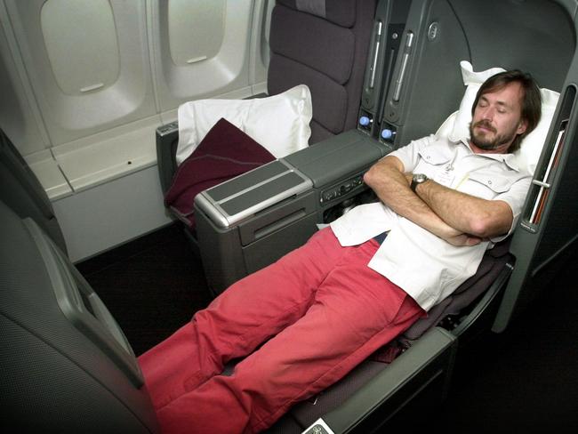 SEPTEMBER 25, 2003 : Designer Marc Newson demonstrates his sleeper seat 'Skybed' at the launch of the new Qantas International Business Class in Sydney 25/9/03. Pic Erica Harrison. Aviation / Aircraft / Plane / Interior