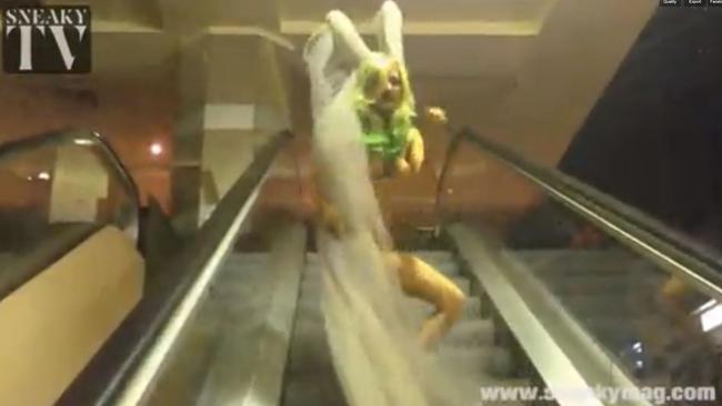 She dances on an escalator before heading out into the CBD. Picture: Sneaky Magazine