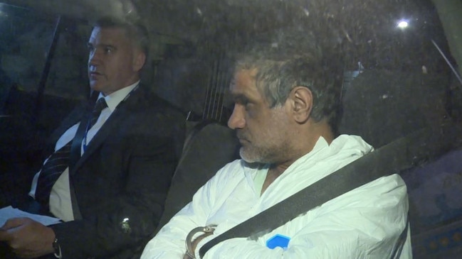 Mohinder Singh, 47, following his arrest in the back seat of a police car. Picture: 7news