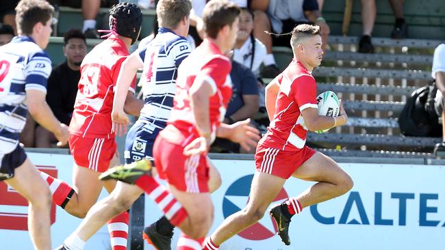 Troy Duckett races away for yet another try in PBC’s quarterfinal win over St Mary’s. Picture: AAP Image/Richard Gosling