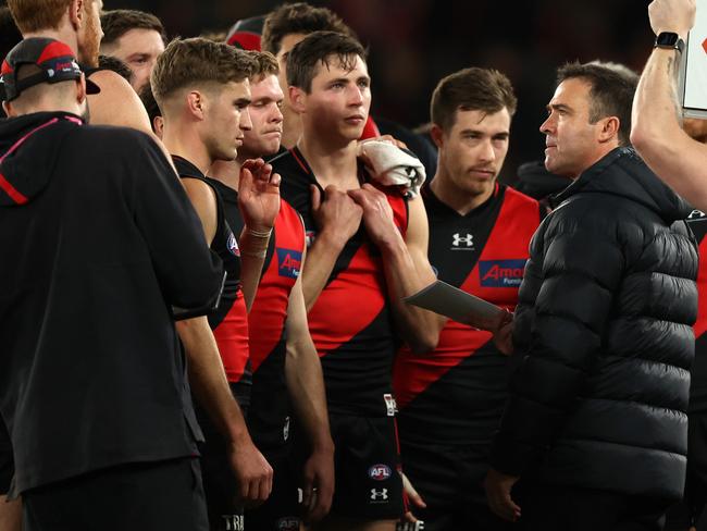 MELBOURNE, AUSTRALIA - AUGUST 05: Bombers coach, Brad Scott speaks to the players at the break during the round 21 AFL match between Essendon Bombers and West Coast Eagles at Marvel Stadium, on August 05, 2023, in Melbourne, Australia. (Photo by Robert Cianflone/Getty Images)