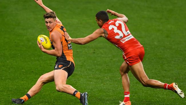 Giant Harry Perryman tries to break past Swan James Bell. Picture: Daniel Carson/AFL Photos via Getty Images