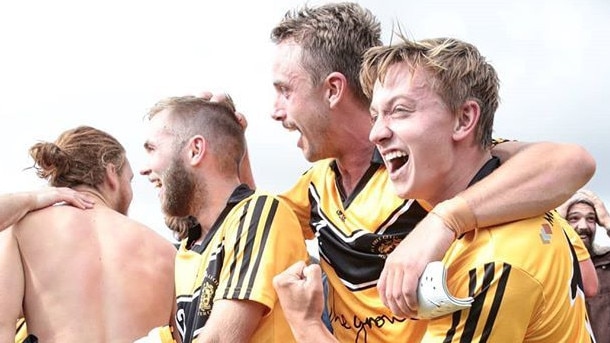 Jubilant Tea Tree Gully players celebrate their shock win over West Adelaide in the FFA Cup SA. Photo: Adam Butler