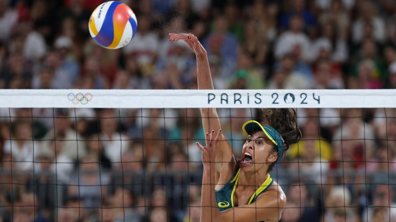 Taliqua Clancy attacks the net during the women's semi-final match against Ana Patricia Silva Ramos and Eduarda Santos Lisboa of Team Brazil. Picture: Lars Baron/Getty Images