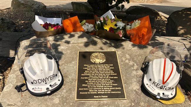 Flowers were laid by a Horsley Park Brigade plaque to commemorate Geoffrey Keaton and Andrew O’Dwyer. Picture: Robert Ovadio.