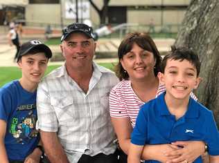 KEEPING STRONG: David Romeo (left) with younger brother Joey (right) and parents Vanessa and Tony. Picture: Selina Venier