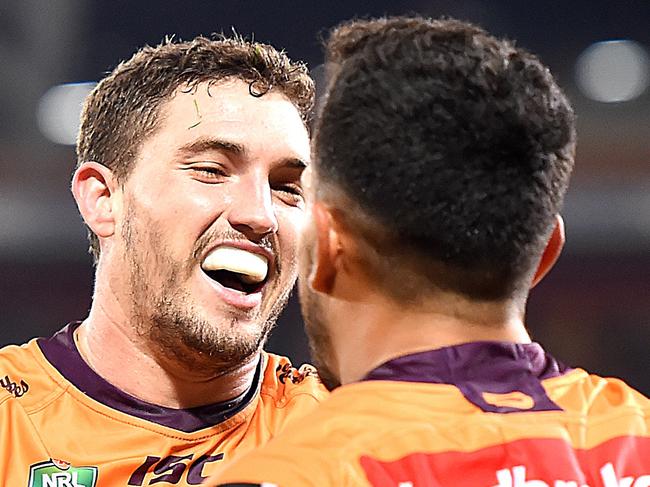 Corey Oates of the Broncos (left) celebrates Jordan Kahu's try during the Round 16 NRL match between the Brisbane Broncos and the Canberra Raiders at Suncorp Stadium in Brisbane, Saturday, June 30, 2018. (AAP Image/Albert Perez) NO ARCHIVING, EDITORIAL USE ONLY