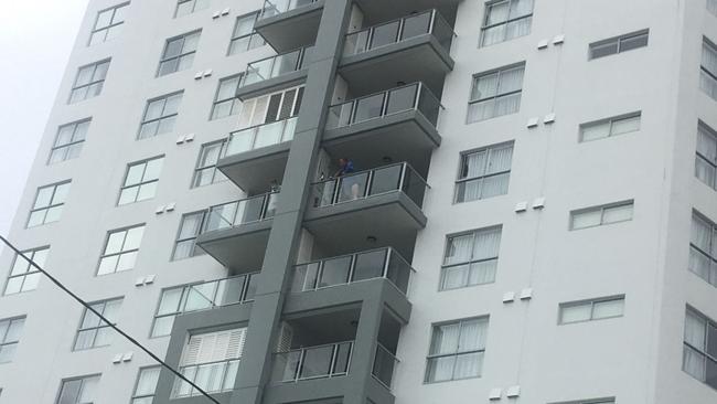 Residents look out from The Oaks Ipswich Aspire Suites building.