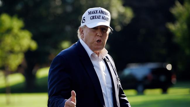 Donald Trump walks off Marine One at the White House. Picture: AFP.