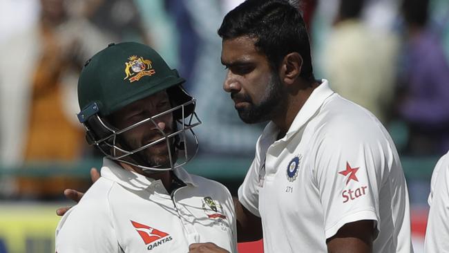 Matthew Wade gets up close with Ravichandran Ashwin. Picture: AP