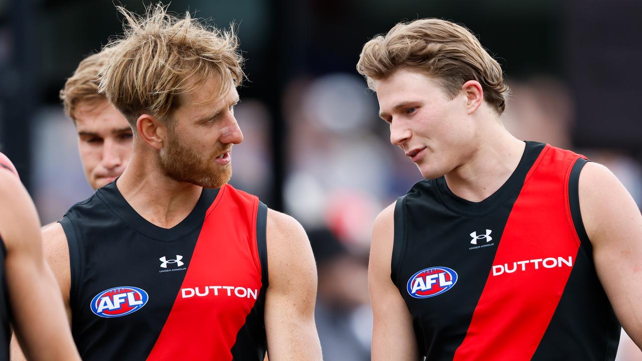 MELBOURNE, AUSTRALIA - FEBRUARY 23: Dyson Heppell of the Bombers chats \with Xavier Duursma of the Bombers during the AFL 2024 Match Simulation between the St Kilda Saints and Essendon Bombers at RSEA Park on February 23, 2024 in Melbourne, Australia. (Photo by Dylan Burns/AFL Photos via Getty Images)