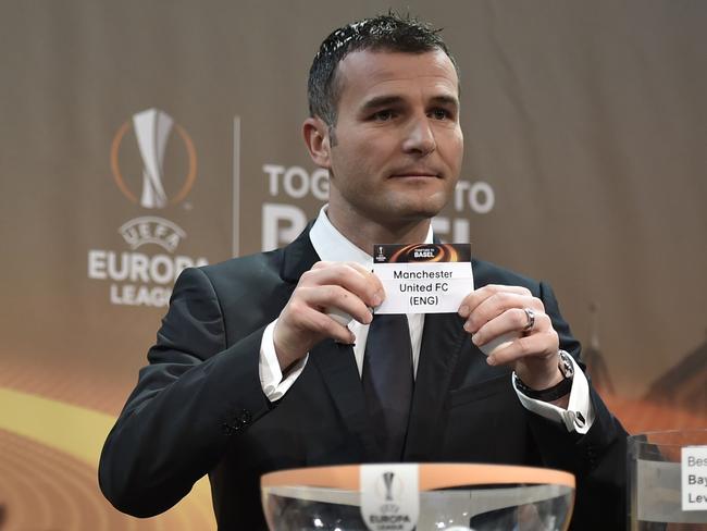 UEFA Europa League final ambassador Alexander Frei shows the name of Manchester United.