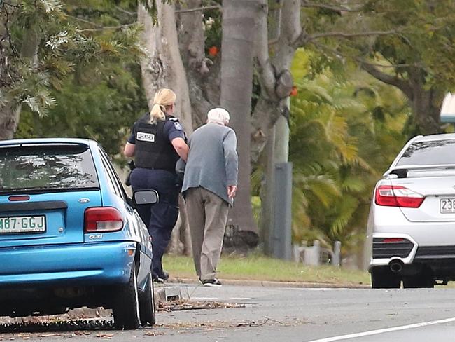 A man who was one of the hostages is released and helped by police. Picture: Jono Searle