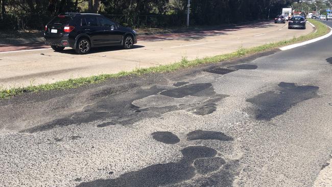 A series of repaired and damaged potholes on busy Pittwater Rd at Dee Why – a road managed and maintained by the NSW Government – in November, 2022. Picture: Jim O'Rourke