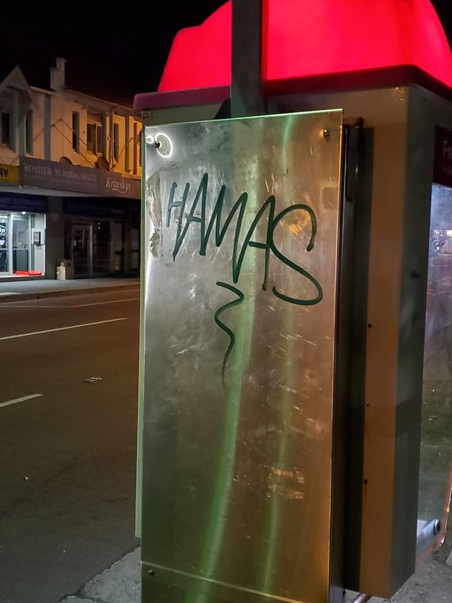 Graffiti on a phone box across the road from a kosher supermarket in Bondi.