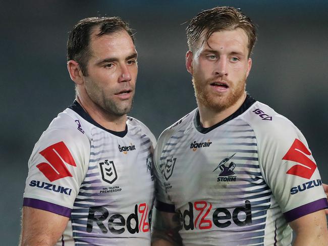 GOSFORD, AUSTRALIA - JUNE 13: Cameron Smith (L) of the Storm celebrates with Cameron Munster (R) at full time during the round five NRL match between the Newcastle Knights and the Melbourne Storm at Central Coast Stadium on June 13, 2020 in Gosford, Australia. (Photo by Matt King/Getty Images)