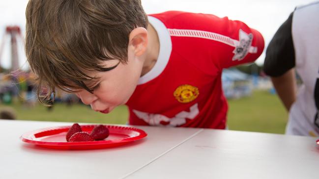 Don’t miss the strawberry eating competition at the Sandstone Point Hotel Strawberry Festival. Photo: Dominika Lis