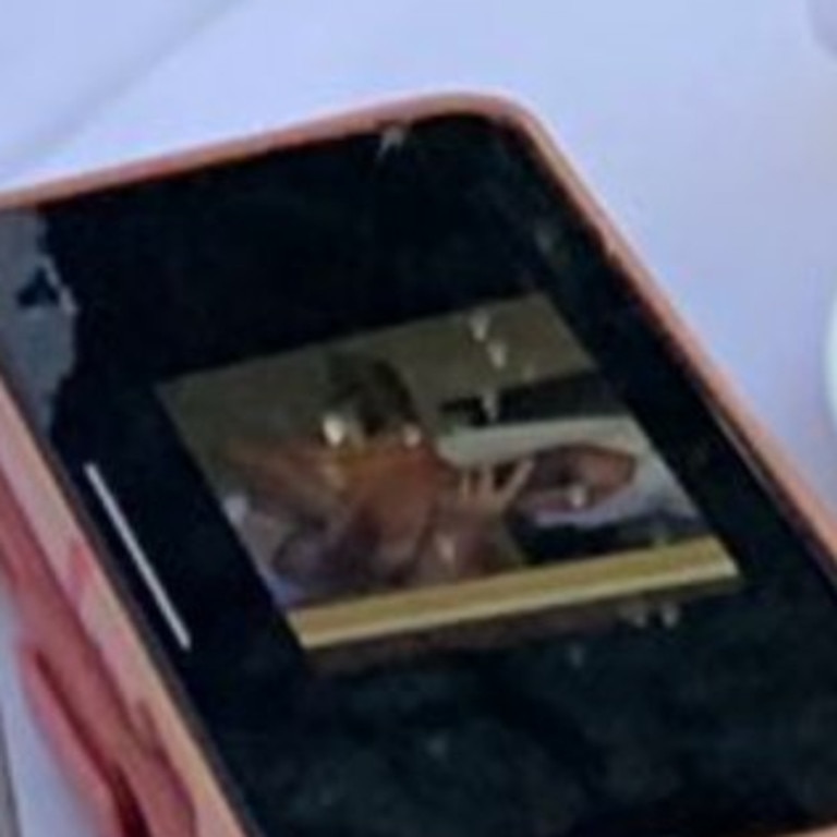 Yep, that’s Chrissy Teigen’s boobs on her phone.