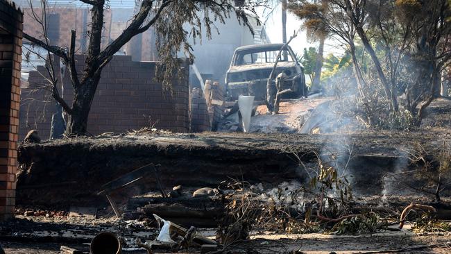 Properties still smoulder after fire ripped through the town on Sunday. Pictures: Ray Strange.