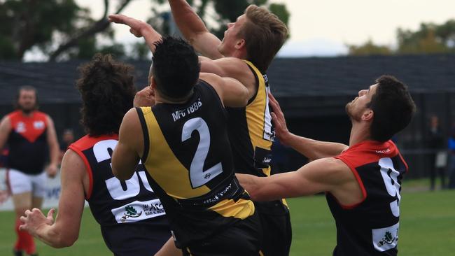 Mitcham players fly for the ball against Montrose on the weekend. Picture: Davis Harrigan