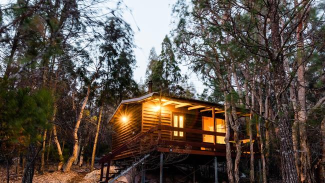 Stay in one of the cosy cedar cabins, complete with log fires, at Granite Belt Retreat and Brewery