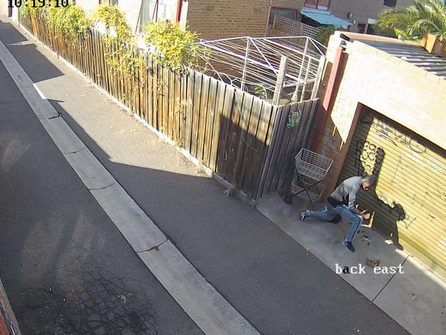 A drug user shoots up in the laneway. Picture: Supplied