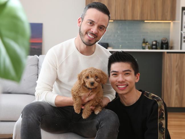 Valentino, 38 and Eric, 27, pictured with puppy Pepper,  have moved into their new home in Torquay.  Geelong and the Bellarine Peninsula has dominated the list of Victoria's most in demand regional areas. Picture: Peter Ristevski