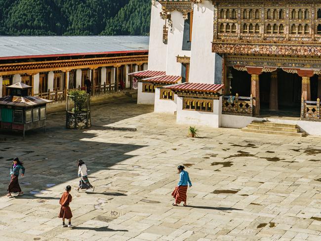 EMBARGO FOR TRAVEL + LUXURY MAGAZINE 17 MARCH 2023. Bhutan. Keys to the Kingdom. PHOTOGRAPHY BY Chris Schalkx. WORDS BY Chris Schalkx. Ask permission to reuse images. Fees will apply. The Gangteng Monastery on a hilltop in central Bhutan.