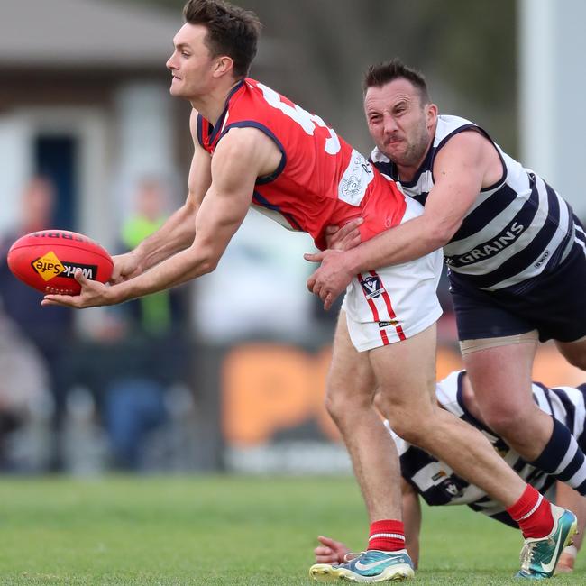 Congupna’s James Boyer is tackled by Finley’s Paul Massingham.