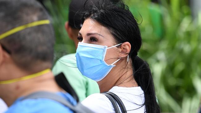 A woman dons a face mask during the Covid-19 pandemic on the Gold Coast. Amie Logsdon simply asked a passenger to adjust their mask. Picture: AAP Image/Dan Peled