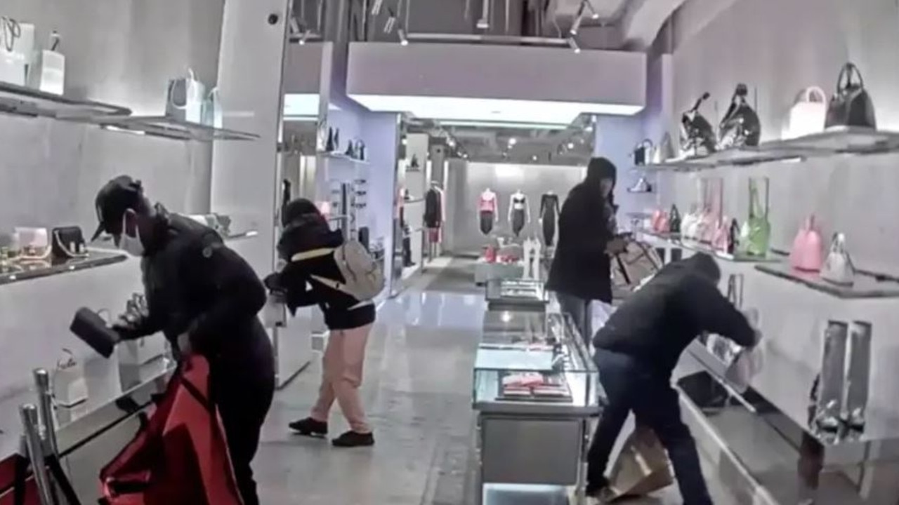 Surveillance footage has captured the moment four brazen thieves bagged $75,000 in luxury merchandise from Givenchy. Picture: New York Police Department